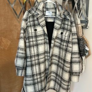 Large size coat. Black and light cream color.